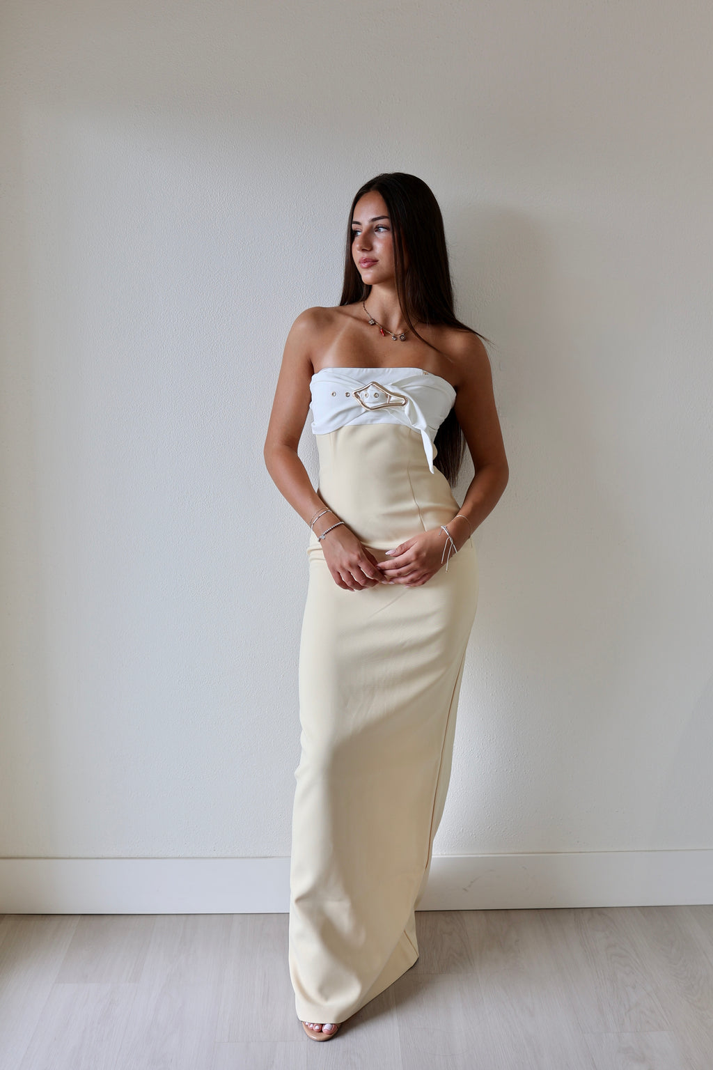 Cream strapless maxi dress with bow bust detail and front leg slit