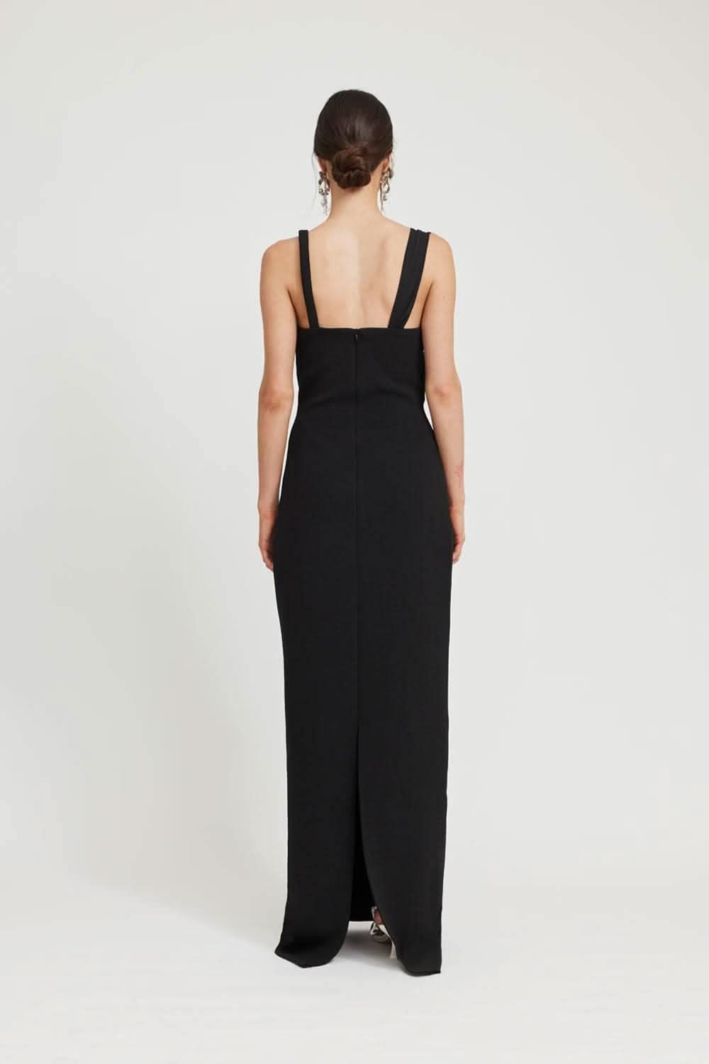 Back of black maxi dress with thin shoulder straps and open back