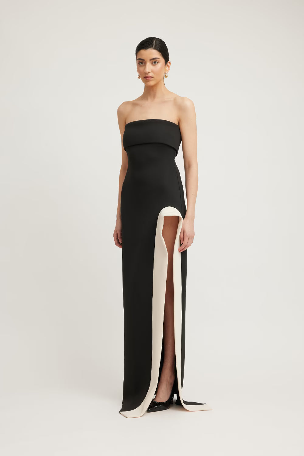 Black strapless column dress with long side slit and champagne insert