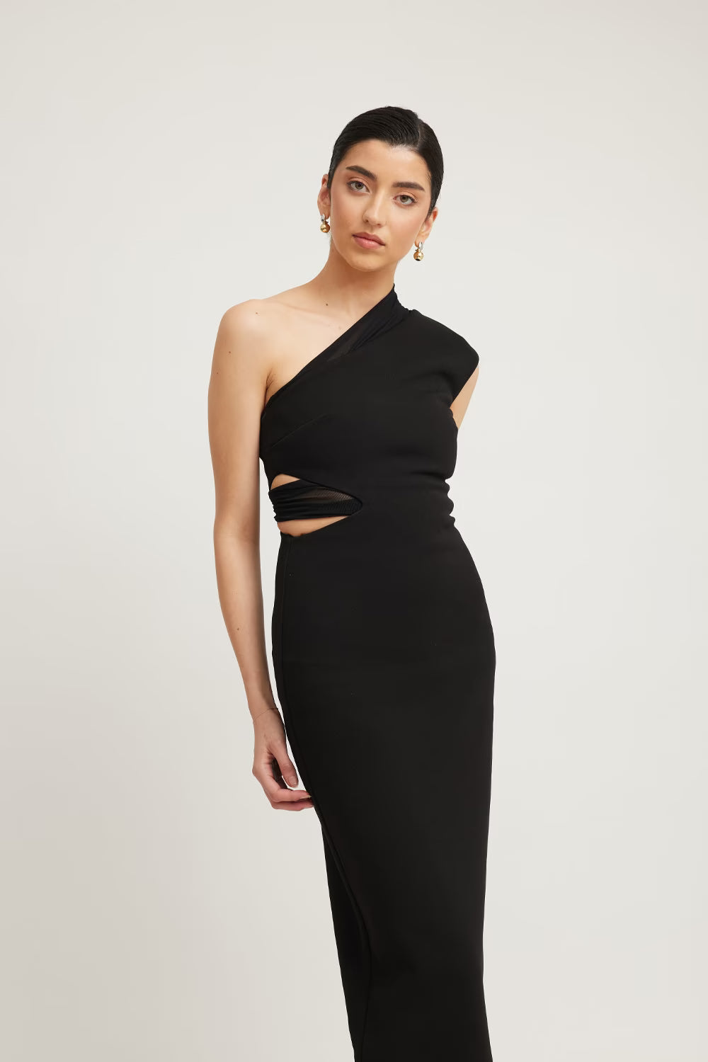 Black one-shoulder column dress with diagonal side cutout detail