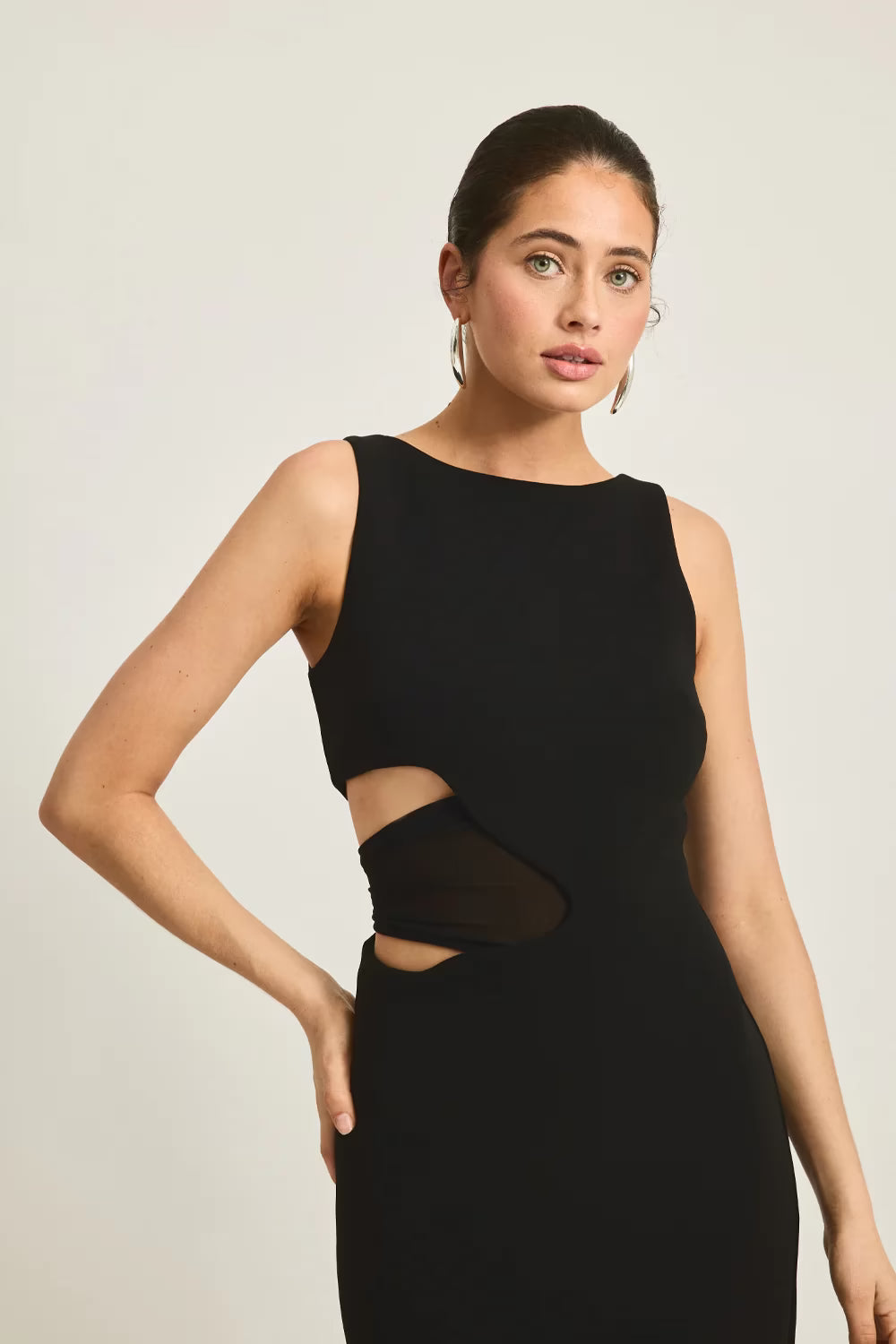 Black sleeveless fitted maxi dress with waist cutout opening