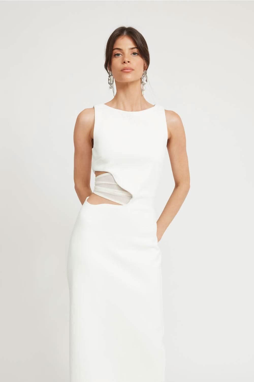 Ivory sleeveless midi dress with scoop neckline and diagonal waist cutout