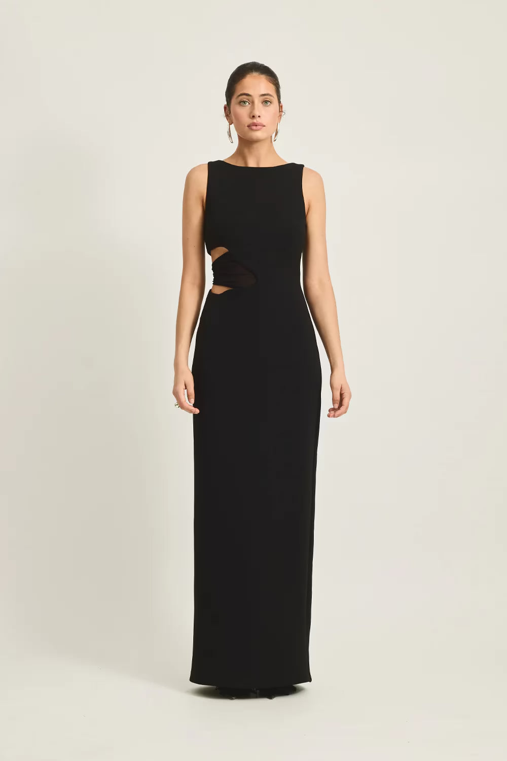 Black sleeveless fitted maxi dress with curved waist cutout