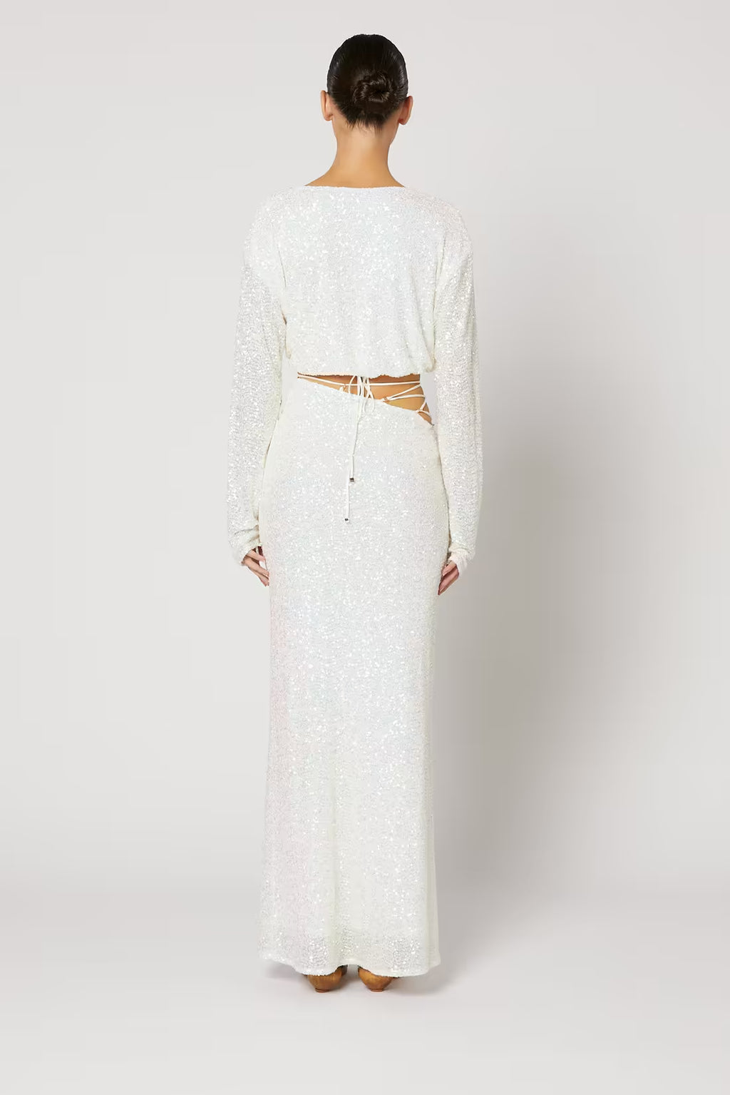 Cristobal sequin maxi skirt in white, back view with fitted waist and flared hem