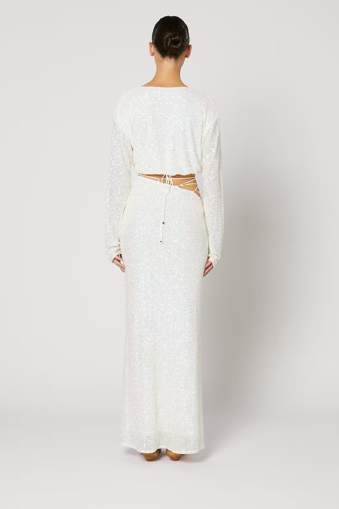 Cristobal sequin maxi skirt in white, back view with fitted waist and flared hem