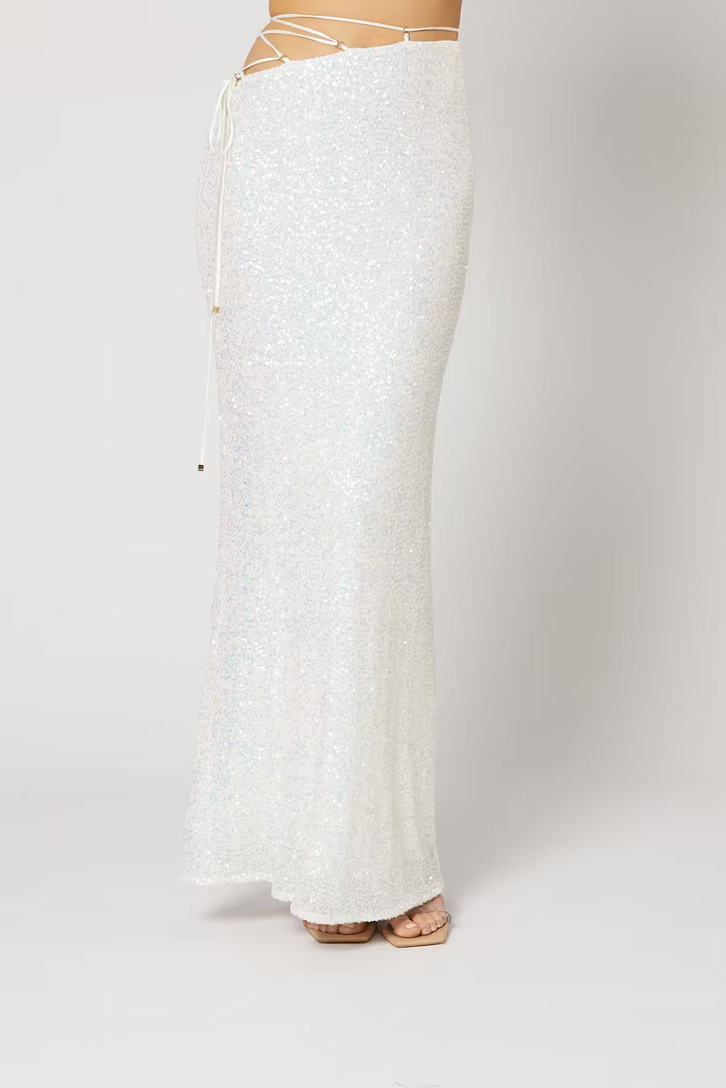 Cristobal sequin maxi skirt in white, close-up of fitted waist and flared hem