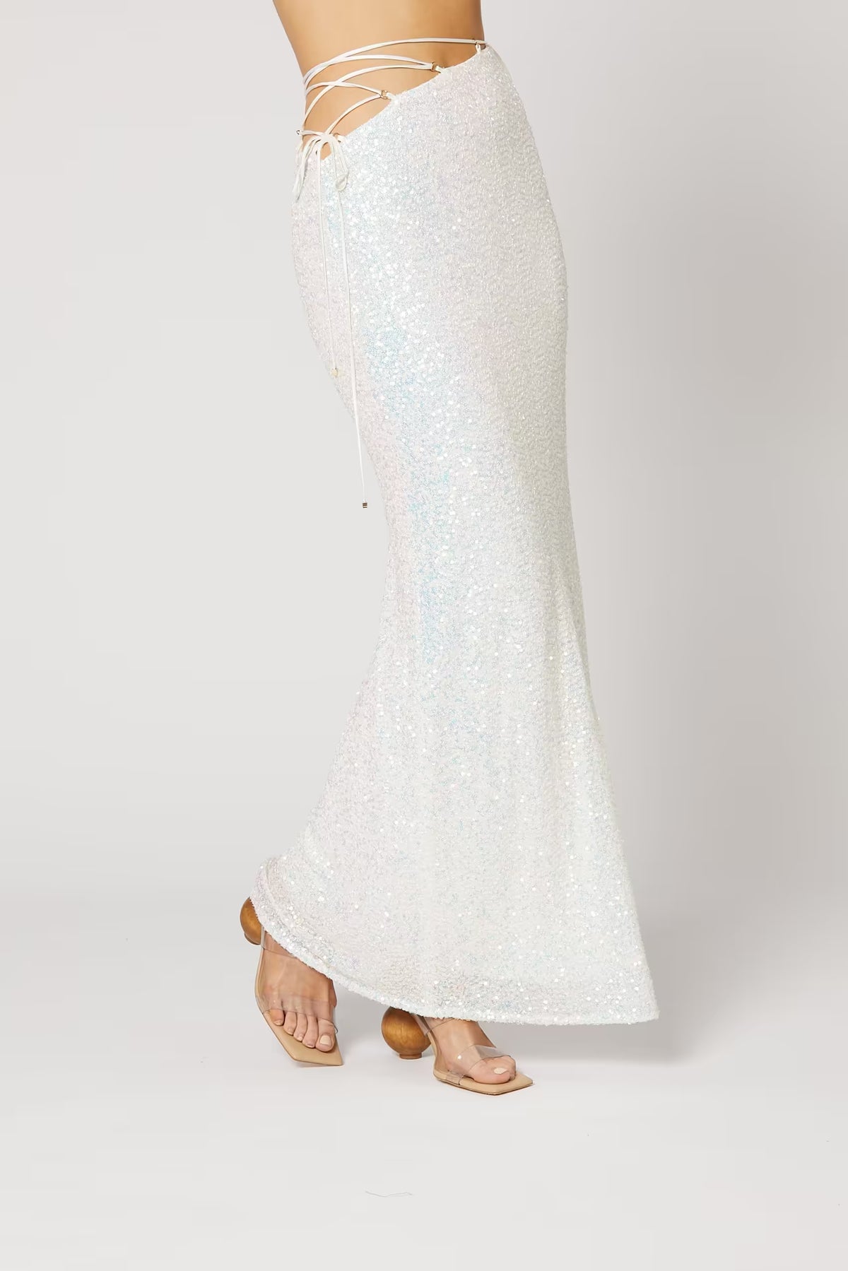 Cristobal sequin maxi skirt in white, side view with fitted waist and flared hem