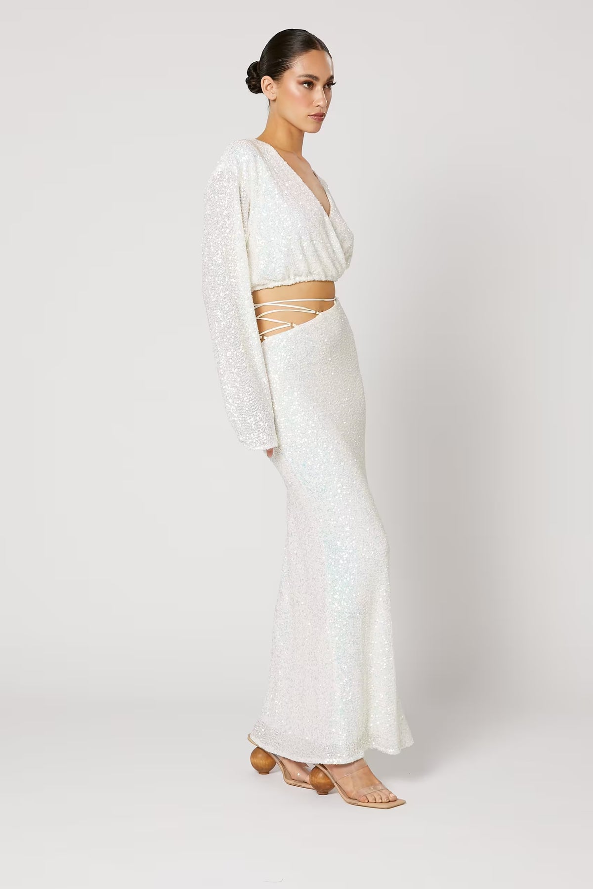 High-waist sequin skirt with long length and fitted drape, light silver-white color