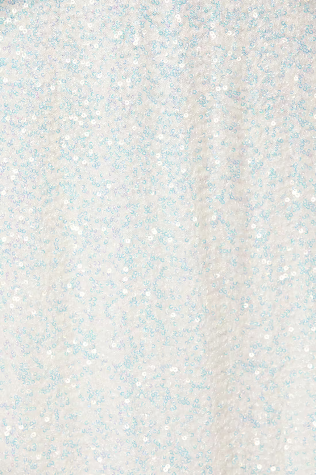 Close-up of light silver-white sequin fabric with small multicolor sparkle flecks