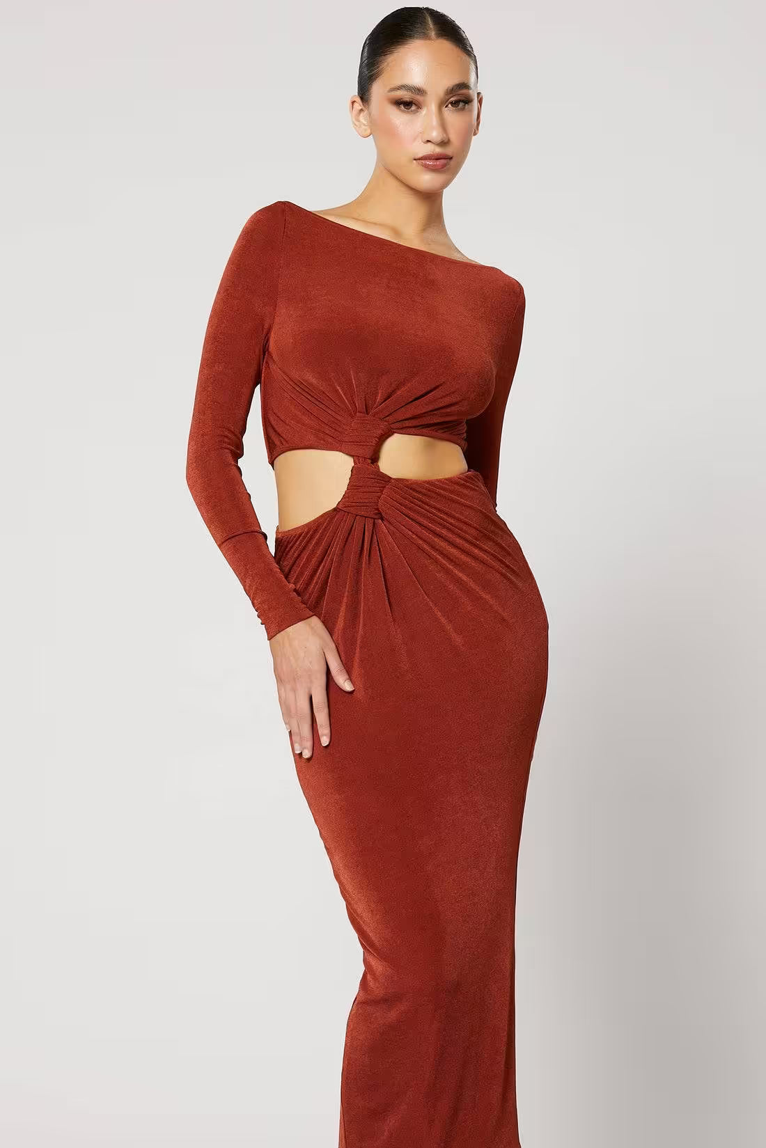 Copper ruched midi dress with long sleeves and knot waist, showing front midriff cutout