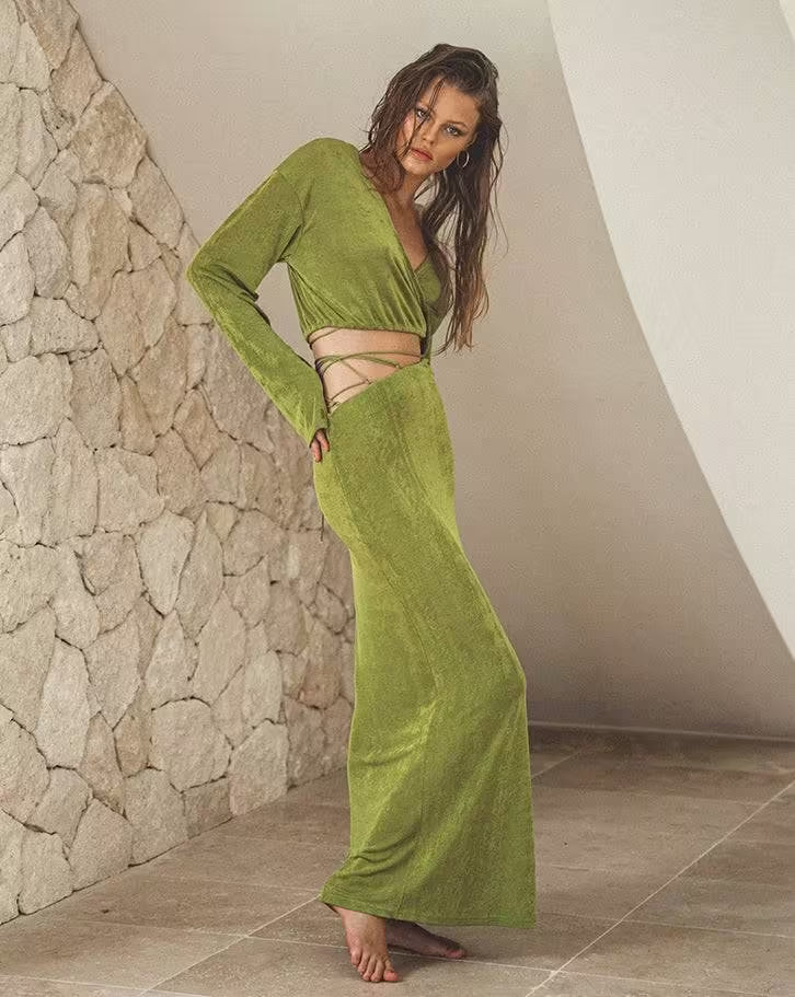 Green wrap V-neck top with long sleeves and fitted tie at waist