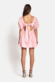 the back of a woman wearing a pink Sofia The Label Aerin Open Back Tie Mini Dress