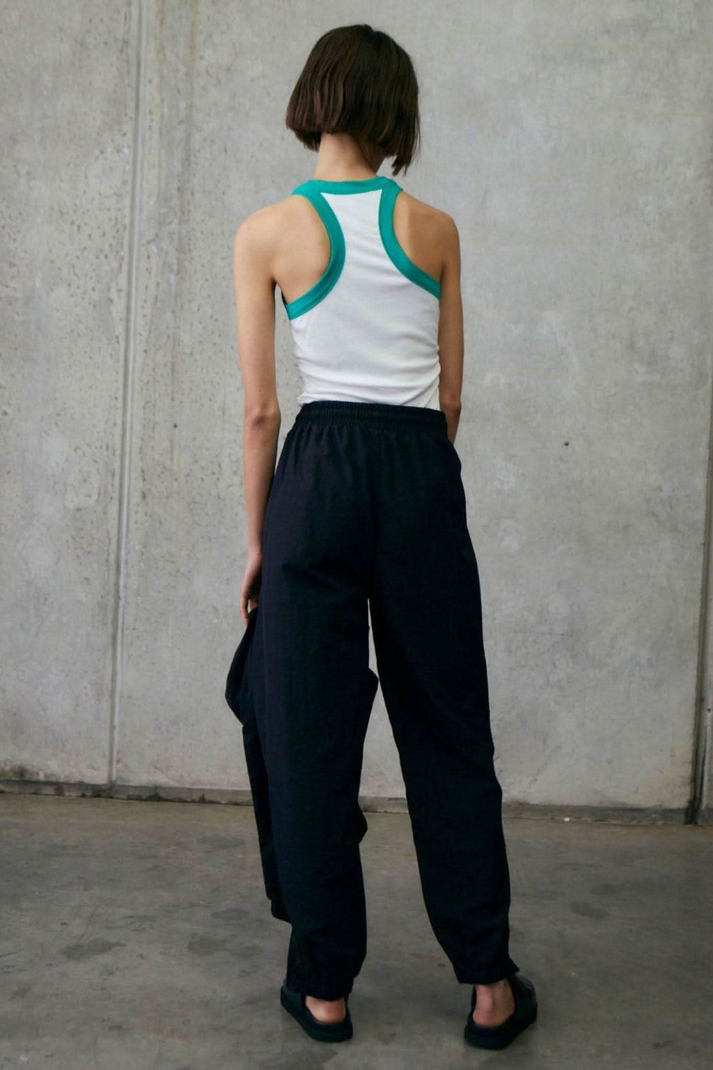 White ribbed tank with alpine green racerback straps, open back design