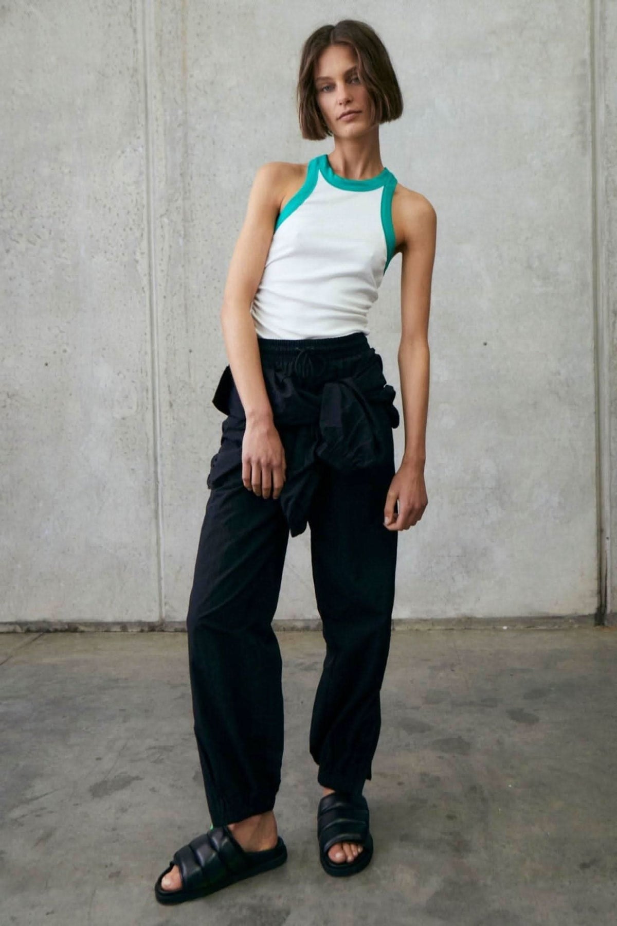 Fitted white rib tank with alpine green trim at neck and armholes