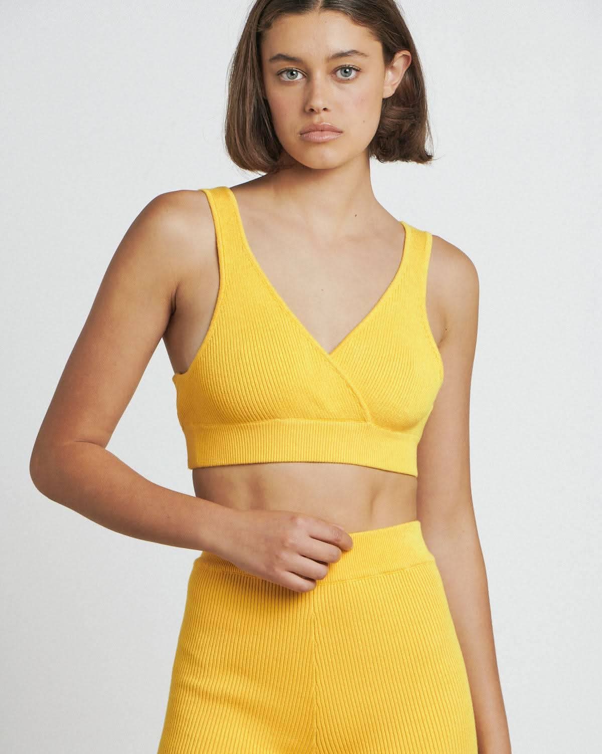 a woman wearing a Bare by Charlie Holiday The Crop Top and shorts