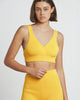 a woman wearing a Bare by Charlie Holiday The Crop Top and shorts