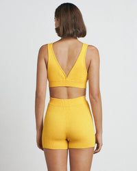 Thumbnail for a woman in a yellow Bare by Charlie Holiday The Crop Top and shorts