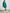 a woman in a green Bare by Charlie Holiday The Long Sleeve Shirt and white tennis shoes